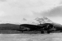 He 111H-6 belonging  2.KG 26 parked along runways. In the foreground 1H + AK.jpg
