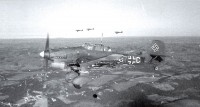 Junkers-Ju-87R-Stuka-12.IV(St)LG1-(L1+CW)-in-formation-over-Finland-1941-01.jpg