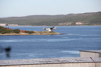 MBR-1936.jpg (140.32 КБ) 75976 просмотров Открыт на о. Большой Грязный в Кольском заливе 29 октября 1968 г.<br />Остров, на котором расположен памятник, находится примерно на полпути от Мурманска до Североморска. На каменном фундаменте с цифрами "1936" стоит старый гидросамолет. Он напоминает о том, как в сентябре 1936г. в трюмах кораблей в ящиках прибыло сюда звено - три первых гидросамолета-разведчика "МБР-2". Здесь их собрали, здесь они впервые поднялись в заполярное небо и начали осваивать район полетов. Первым командиром звена был ст. лейтенант Г.В.Степанов. На базе этого звена со временем образовался морской разведывательный полк не раз отличавшийся в годы Великой Отечественной войны". В составе полка служил и гидросамолет, ставший памятником. Первым его пилотом и командиром экипажа долго был Л.И.Анифер. После войны этот гидросамолет стал летать на ледовую разведку в Арктику. Свой последний полет "МБР-2" совершил в мае 1963 года. Через несколько месяцев он стал памятником.